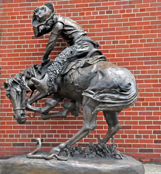 cowboy on bucking horse sculpture